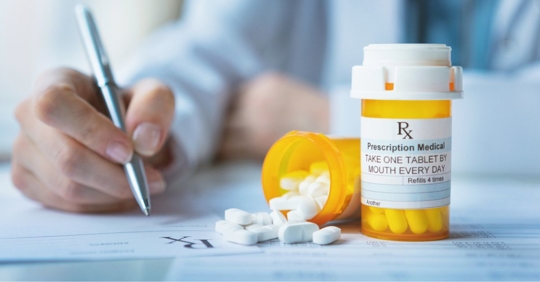 Doctor writing a prescription